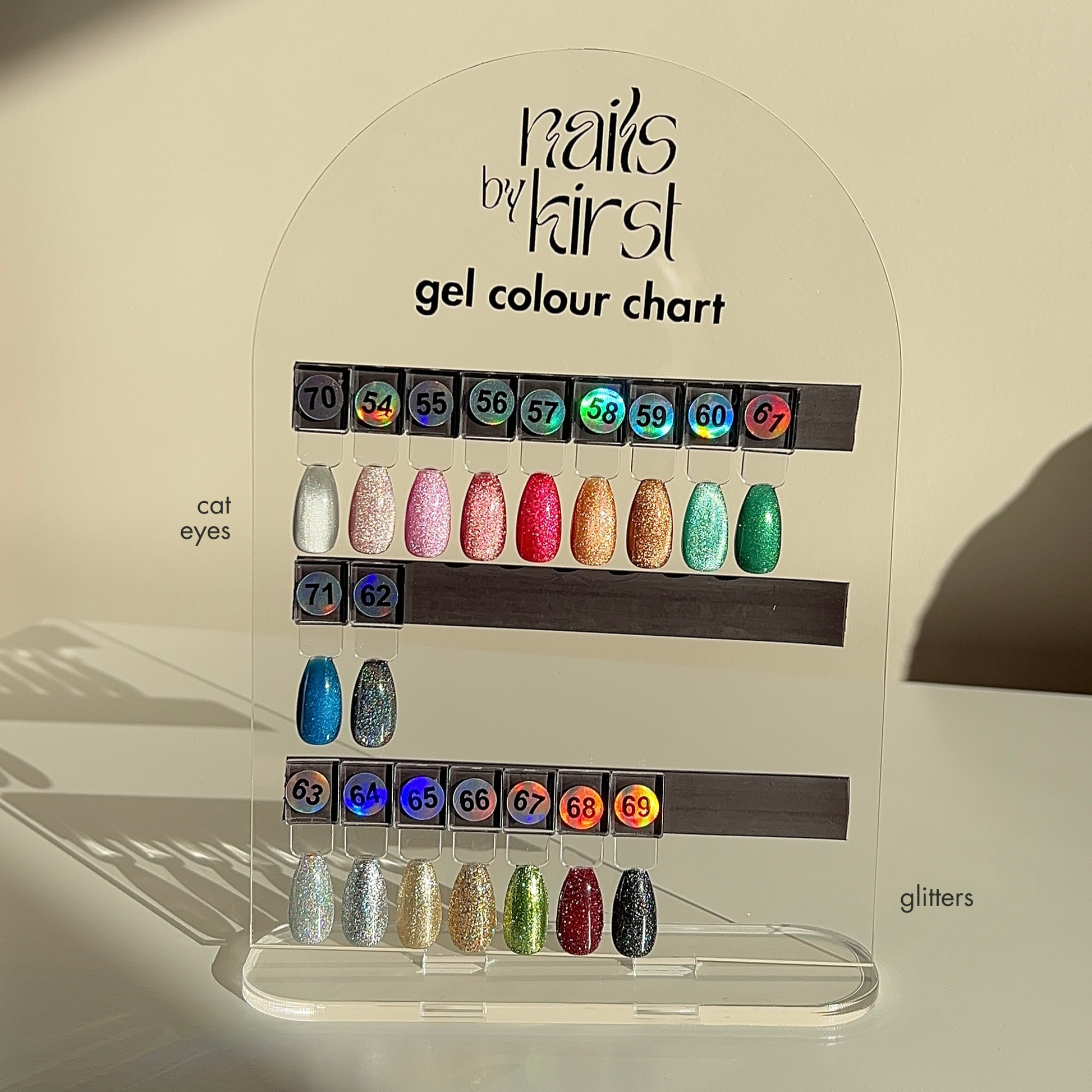Nails by Kirst gel colour chart with various cat eye and glitter gel polish swatches 